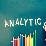 the word “analytics” above coloring pencils