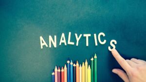 the word “analytics” above coloring pencils